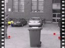 basketball passing behind bin