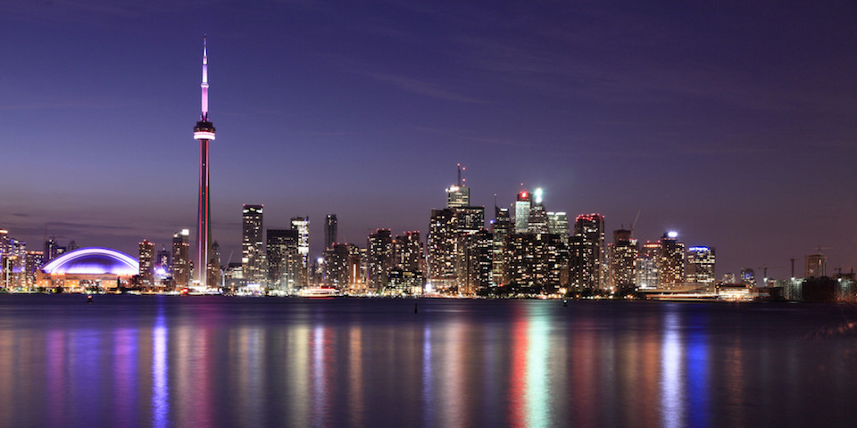 The Toronto skyline and CN Tower at night, seen across the water