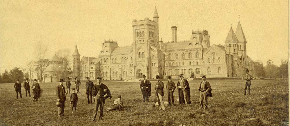 An archival photograph of people on the lawn in front of a University of Toronto building