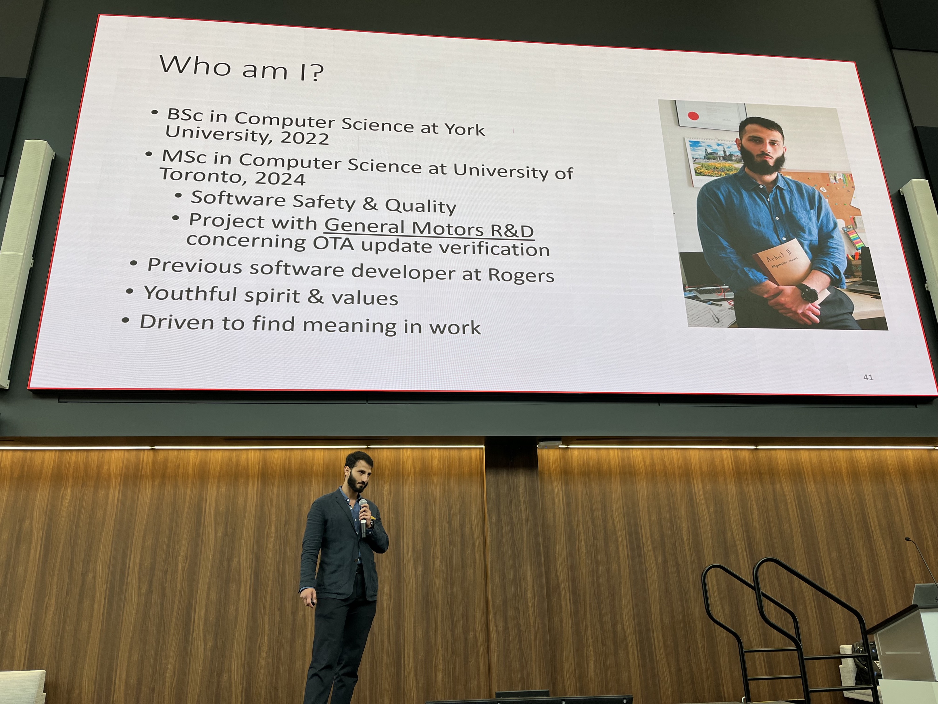 A picture of me giving a talk at General Motors